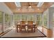 Bright dining room featuring wood ceiling and multiple windows offering serene outdoor views at 8820 Mud Creek Rd, Indianapolis, IN 46256