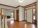 Foyer featuring hardwood flooring, natural light, and classic wood trim details at 8820 Mud Creek Rd, Indianapolis, IN 46256