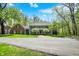 Beautiful two-story home exterior, lush lawn, mature trees, and scenic surroundings at 8820 Mud Creek Rd, Indianapolis, IN 46256