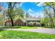Beautifully landscaped home exterior, featuring a well-manicured lawn and a detached garage at 8820 Mud Creek Rd, Indianapolis, IN 46256