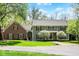 Inviting front exterior featuring a two-story home, well-manicured lawn and beautiful landscaping at 8820 Mud Creek Rd, Indianapolis, IN 46256