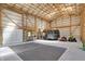 The spacious garage has recreational equipment, offering versatile storage or a workshop area with high ceilings and ample space at 8820 Mud Creek Rd, Indianapolis, IN 46256