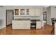 Kitchen with granite countertops, custom white cabinets, an eating area, and hardwood floors, adding to the home's charm at 8820 Mud Creek Rd, Indianapolis, IN 46256