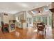 Bright kitchen with wood floors, a skylight and view into the connected dining room at 8820 Mud Creek Rd, Indianapolis, IN 46256