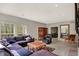 Inviting living room with a sectional sofa, a fireplace, and lots of natural light at 8820 Mud Creek Rd, Indianapolis, IN 46256