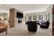 Spacious living room featuring a stone fireplace and comfortable seating at 8820 Mud Creek Rd, Indianapolis, IN 46256