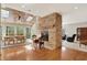 Interior view showcasing a stone fireplace between the dining area and the living room at 8820 Mud Creek Rd, Indianapolis, IN 46256