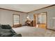 Inviting living room featuring classic wood trim, neutral tones, and abundant natural light at 8820 Mud Creek Rd, Indianapolis, IN 46256