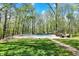 Landscaped backyard features an inviting in-ground pool perfect for relaxation and outdoor entertainment at 8820 Mud Creek Rd, Indianapolis, IN 46256