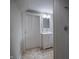 A simple bathroom with a tiled floor, a single vanity and a mirror above it at 933 N 19Th N St, Elwood, IN 46036