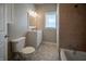 Updated bathroom featuring a modern vanity, tiled shower, and neutral color scheme at 933 N 19Th N St, Elwood, IN 46036