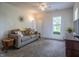 Comfortable living room with a plush sofa, neutral decor, and natural light at 933 N 19Th N St, Elwood, IN 46036