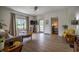 Bright living room featuring hardwood floors, large windows, and an open layout at 933 N 19Th N St, Elwood, IN 46036