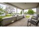 Covered porch offering scenic views, with chairs creating a relaxing outdoor space at 933 N 19Th N St, Elwood, IN 46036