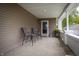 Cozy porch features neutral siding, comfortable seating, and a welcoming entrance at 933 N 19Th N St, Elwood, IN 46036