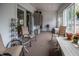Inviting sunroom with neutral tones, multiple seating options, and abundant natural light at 933 N 19Th N St, Elwood, IN 46036