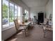 Bright sunroom with large windows offering great views, comfortable seating, and calming decor at 933 N 19Th N St, Elwood, IN 46036