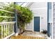 Charming backyard featuring a blue door, climbing vines, and a cozy outdoor space at 952 Elm St, Indianapolis, IN 46203