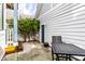 Inviting backyard with patio featuring a table and chair set, with climbing vines on a fence at 952 Elm St, Indianapolis, IN 46203