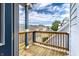 Exterior balcony showing wood flooring, railings and a view of the neighborhood at 952 Elm St, Indianapolis, IN 46203