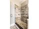 Stylish bathroom with a glass shower featuring decorative stone accents at 952 Elm St, Indianapolis, IN 46203