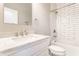 Beautiful bathroom featuring a shower, updated vanity, and neutral wall paint at 952 Elm St, Indianapolis, IN 46203