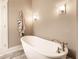 Bright bathroom features a modern soaking tub with beautiful fixtures and stylish lighting at 952 Elm St, Indianapolis, IN 46203