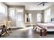 Bright bedroom with natural light, hardwood floors, and a cozy seating area at 952 Elm St, Indianapolis, IN 46203