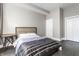 Modern bedroom with stylish decor, hardwood floors, and neutral wall paint at 952 Elm St, Indianapolis, IN 46203