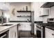 Beautiful kitchen with modern appliances, subway tile backsplash, and dark countertops at 952 Elm St, Indianapolis, IN 46203