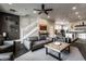 Open-concept living room with stylish decor and an open view to the kitchen at 952 Elm St, Indianapolis, IN 46203