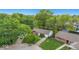 An aerial view of the home set amongst beautiful greenery and lush landscaping at 9526 Burrwood Ct, Indianapolis, IN 46235