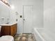 This bathroom features a tub and a single sink vanity at 9526 Burrwood Ct, Indianapolis, IN 46235