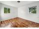 This bright bedroom has wood floors and sun filled windows at 9526 Burrwood Ct, Indianapolis, IN 46235