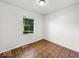 Bedroom with unique flooring, one window, and white walls at 9526 Burrwood Ct, Indianapolis, IN 46235