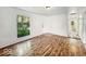 Bright bedroom with wood-look flooring, window, neutral paint, and closet at 9526 Burrwood Ct, Indianapolis, IN 46235