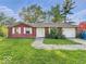 Charming single-story home featuring a two-car garage and a well-maintained front yard at 9526 Burrwood Ct, Indianapolis, IN 46235