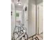 Hallway featuring unique black and white stone-like flooring and white walls at 9526 Burrwood Ct, Indianapolis, IN 46235