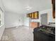 Bright kitchen with tile floors, wood cabinets and white walls at 9526 Burrwood Ct, Indianapolis, IN 46235