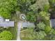 An aerial view of a charming home with a long driveway, and fenced backyard at 9860 Sunnymeade Ln, Indianapolis, IN 46280