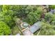 An aerial view of a lovely home, long driveway, with a fenced backyard and mature trees at 9860 Sunnymeade Ln, Indianapolis, IN 46280