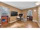 Bedroom with two windows, hardwood floors, and space for an office area at 9860 Sunnymeade Ln, Indianapolis, IN 46280