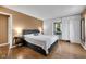 Bedroom with hardwood floors, built-in storage, and a large bed at 9860 Sunnymeade Ln, Indianapolis, IN 46280