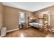 Bedroom featuring wood bunk bed, hardwood floors, and natural light at 9860 Sunnymeade Ln, Indianapolis, IN 46280
