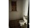 Bathroom featuring a toilet and window at 1014 W 33Rd St, Indianapolis, IN 46208
