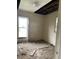 Bedroom with visible ceiling damage and debris on the floor at 1014 W 33Rd St, Indianapolis, IN 46208