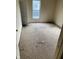 A bedroom with torn carpet and visible wall damage at 1014 W 33Rd St, Indianapolis, IN 46208