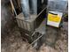 Furnace in the basement surrounded by debris at 1014 W 33Rd St, Indianapolis, IN 46208