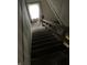 Stairway with wooden banister leading down at 1014 W 33Rd St, Indianapolis, IN 46208