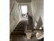 Stairway with wooden banister leading down at 1014 W 33Rd St, Indianapolis, IN 46208